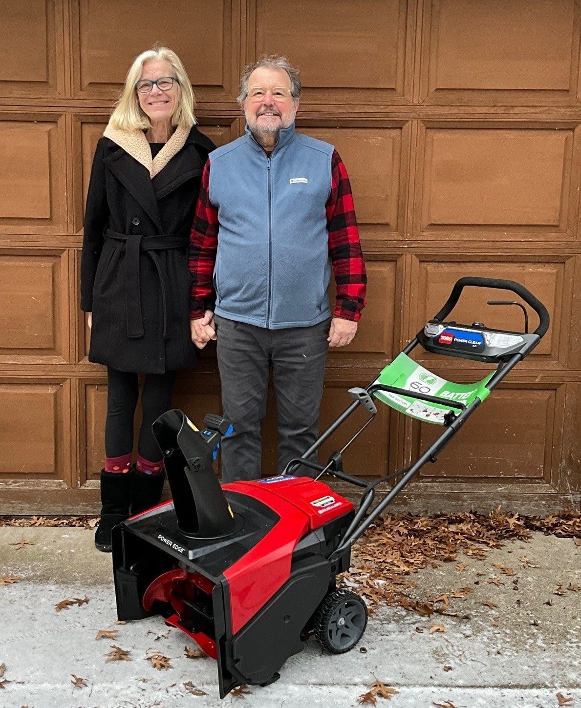 man woman snowblower